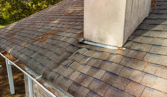 shingle roof with several damaged
