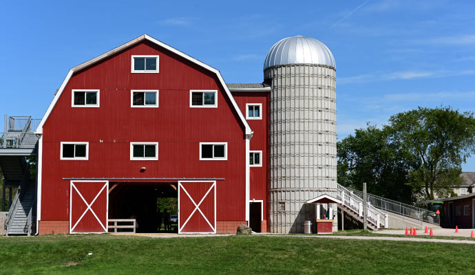 A large barn house from the front view.