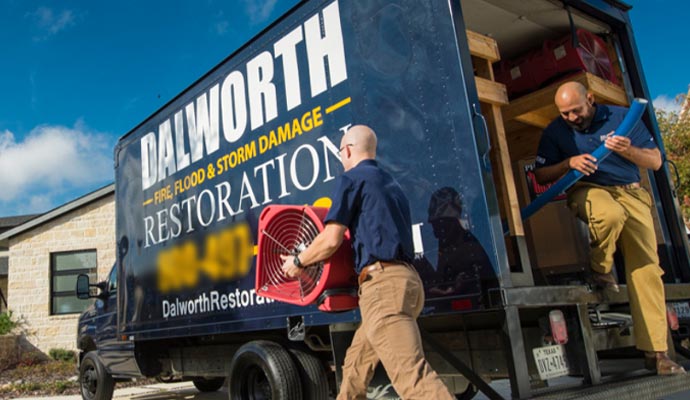 Dalworth restoration team with service vehicle