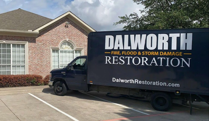 Dalworth Restoration service vehicle in front of a house