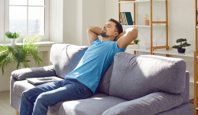 Person relaxing on a sofa