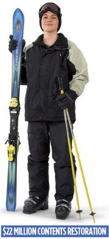 a person in ski clothes with ski equipment