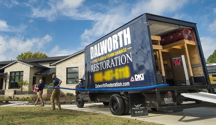 Dalworth restoration team with service vehicle