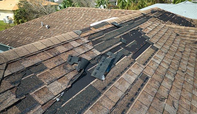 Damaged house roof Damaged house roof