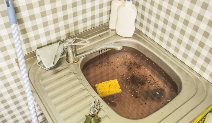 A clogged kitchen sink