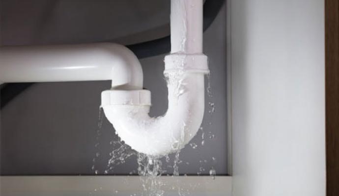 Water leaking from damaged pipe Water leaking from damaged pipe