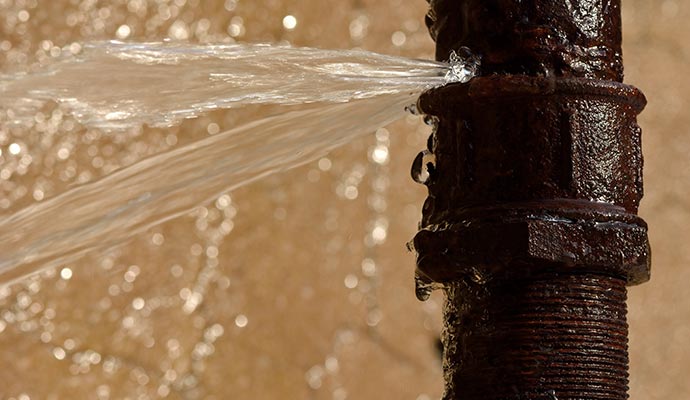 Close-up view of a broken water pipe